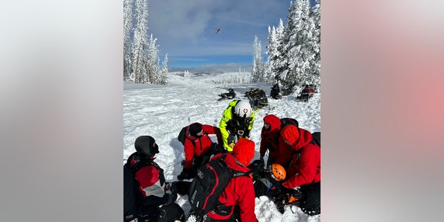 The injured 21-year-old snowmobiler used a personal locator device to alert rescuers to his location in a remote area near Currant Creek Peak in Wasatch County, Utah.