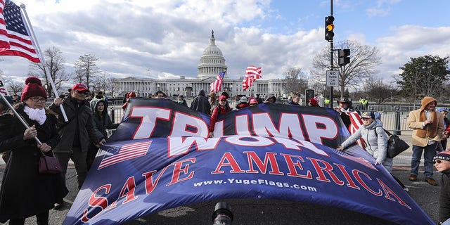 Trump supporters gather outside the U.S. Capitol building on January 6, 2023. 