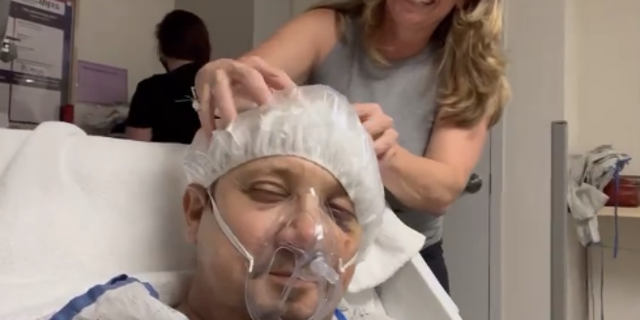 The Marvel star is seen getting his head massaged while wearing a hairnet, breathing medical mask and lying down on the hospital bed. 