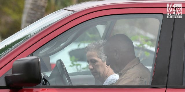 Brian Laundrie's parents, Chris and Roberta Laundrie, are seen outside their home in Sarasota County, Florida on Oct.19, 2022.