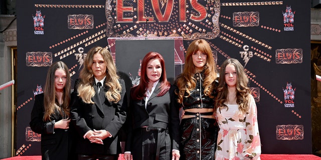 From left, Harper Vivienne Ann Lockwood, Lisa Marie Presley, Priscilla Presley, Riley Keough, and Finley Aaron Love Lockwood attend the Handprint Ceremony honoring Three Generations of Presleys at TCL Chinese Theatre on June 21, 2022, in Hollywood, California. 