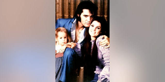 Elvis Presley with Priscilla Presley and their daughter Lisa Marie Presley, circa 1970. The singer passed away in 1977 at age 42.