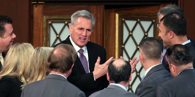 WASHINGTON, DC - JANUARY 04: U.S. House Republican Leader Kevin McCarthy (R-CA) talks to members-elect in the House Chamber during the second day of elections for Speaker of the House at the U.S. Capitol Building on January 4, 2023, in Washington, D.C.