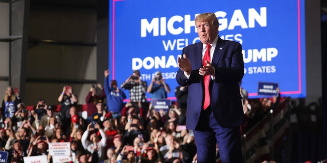 Former President Donald Trump arrives at a rally on April 2, 2022, near Washington, Michigan.