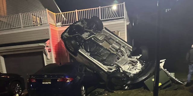 Police in New Jersey released body camera video of a stolen car going over a guardrail, crashing on a house, and narrowly avoiding a person who was walking nearby.