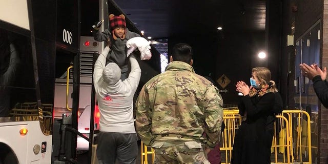 Migrants arriving from Del Rio, Texas, get off a bus at Port Authority in Manhattan on Monday, Dec. 19, 2022. Another bus that arrived in New York City from El Paso had a five-day journey through the winter storm that disrupted travel.