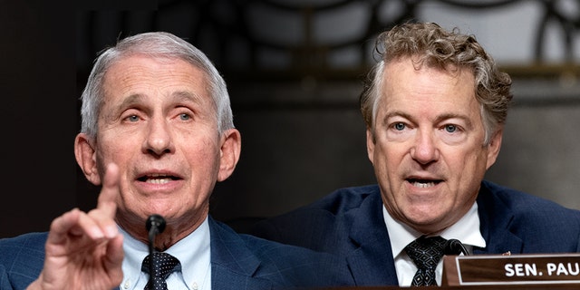 Dr. Anthony Fauci, left, and Sen. Rand Paul clash during a Senate committee hearing, Jan. 11, 2022.