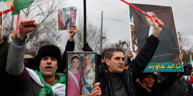 An activist is shown during a gathering in support of Iran's anti-government protesters, in Strasbourg, France, on Jan. 16, 2023. The city of Paris is preparing an Eiffel Tower tribute to Mahsa Amini, who died after being detained by Iran's morality police