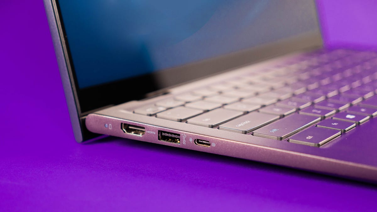 Laptop on a purple background