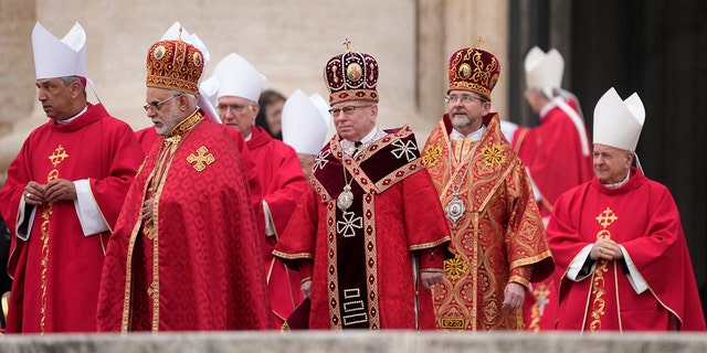 Cardinals arrive in procession ahead of the funeral mass for late Pope Emeritus Benedict XVI in St. Peter's Square at the Vatican, Thursday, Jan. 5, 2023. Benedict died at 95 on Dec. 31 in the monastery on the Vatican grounds where he had spent nearly all of his decade in retirement. 