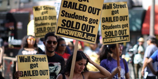 Students protest the rising costs of student loans for higher education on Hollywood Boulevard on Sept. 22, 2012 in the Hollywood section of Los Angeles.