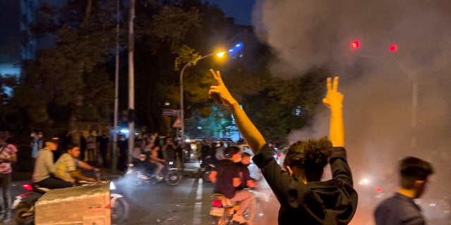 A man gestures during a protest over the death of Mahsa Amini, a woman who died after being arrested by the Islamic republic's "morality police", in Tehran, Iran Sept. 19, 2022.