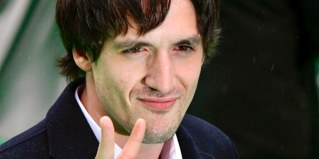 FILE: Artur Smolyaninov, a prominent Russian film and theater actor, gestures as he arrives at the opening ceremony of the 31st Moscow International Film Festival in Moscow, Friday, June 19, 2009.