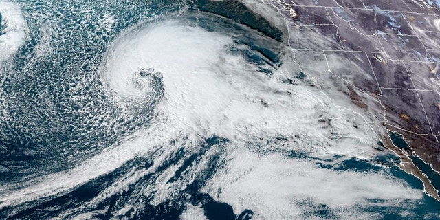 This satellite image made available by NOAA shows a storm system approaching the U.S. West coast on Tuesday, Jan. 3, 2023, at 6:36 p.m. EST. (NOAA via AP)