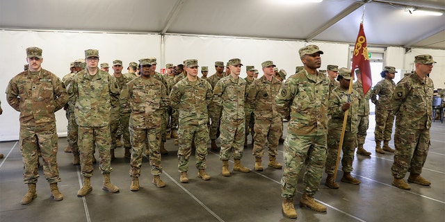 U.S. Soldiers of the 330th Movement Control Battalion stand in formation.