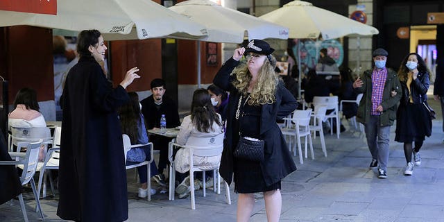 Tourists are seen in the streets of Madrid, Spain, on March 27, 2021.