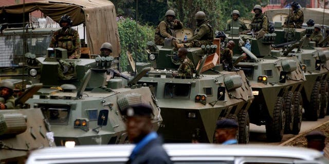 NAIROBI, KENYA - SEPTEMBER 25: (SOUTH AFRICA OUT)  KDF Officers leave the Westgate Mall on September 25, 2013 in Nairobi, Kenya. The Mall was hit with a terrorist attack on Saturday, 10-15 gunmen from the extremist group Al-Shabab entered the mall and opened fire at random on shoppers; 68 deaths have been confirmed.  