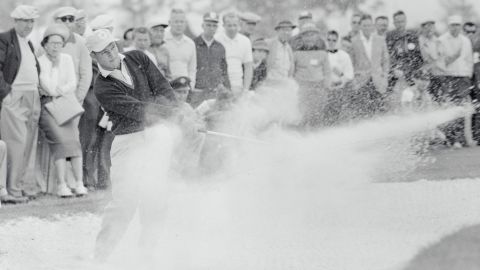 Palmer plays a shot from the bunker at the seventh hole at the Desert Inn Country Club.