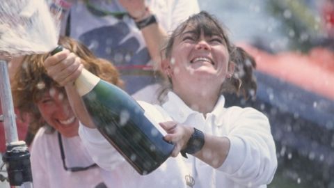 Tracy Edwards, skipper of Maiden, celebrates with champagne after finishing second during the Whitbread round the world yacht race in 1990.