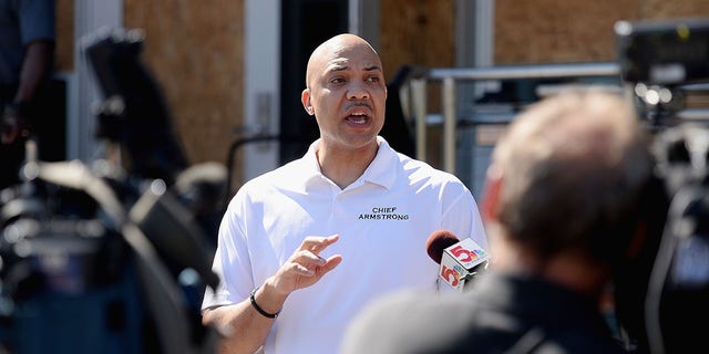 Ferguson Police Chief Jason Armstrong speaks to media as volunteers help cleanup from an overnight clash between protesters and law enforcement at the Ferguson Police Department on May 31, 2020, in Ferguson, Missouri. Major cities nationwide saw demonstrations over the death of George Floyd.