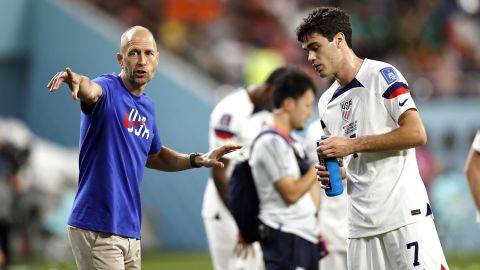 Gregg Berhalter talks to Gio Reyna during the World Cup round of 16 match against the Netherlands.