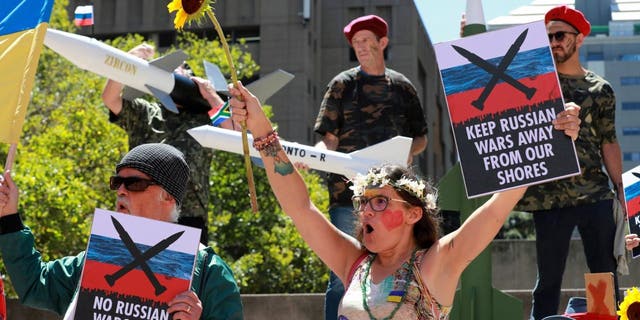 A protest is held outside the Russian consulate in Cape Town, South Africa, Friday, Feb. 17, 2023.