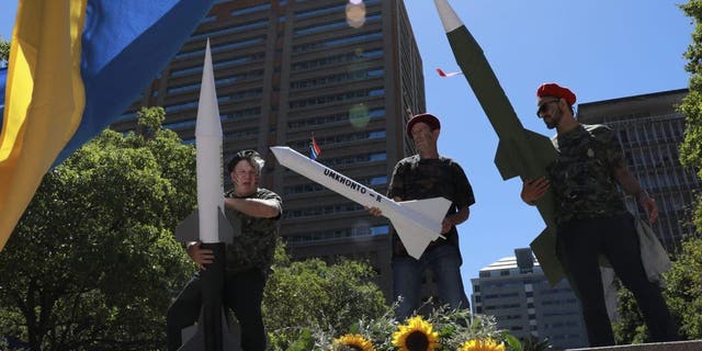 A protest is held outside the Russian consulate in Cape Town, South Africa, Friday, Feb. 17, 2023, against naval exercises off the east coast of the country.