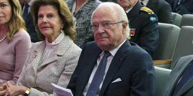 Sweden's King Carl XVI Gustaf, right, sits during a visit to the King Hussein Cancer Center in Amman, Jordan, Nov 16, 2022. King Carl XVI Gustaf is doing well after a heart surgery.