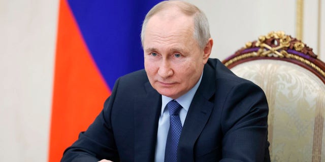 Russian President Vladimir Putin chairs a meeting on the social and economic development of Crimea and Sevastopol via a videoconference at the Moscow's Kremlin in Moscow, Russia, Friday, March 17, 2023.