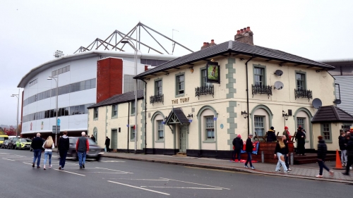 The Turf pub is a must-see for Wrexham fans. Here fans are pictured outside the venue ahead of an FA Cup tie in November 2022. 