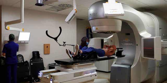 A patient is seen during a stereotactic radiotherapy treatment