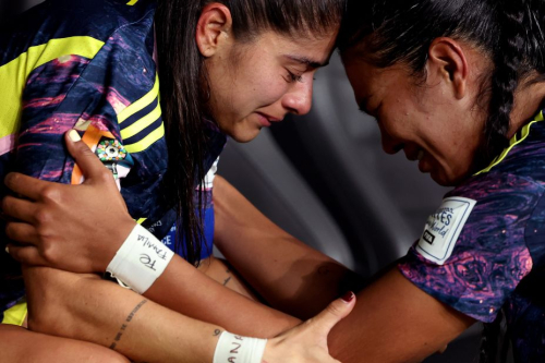 Colombia's Catalina Usme and Daniela Arias show dejection after the team's defeat.