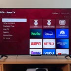 TCL 4 Series Roku TV on a stand