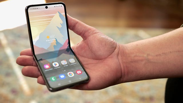 The Galaxy Z Flip 4 in Flex Mode in someone's palm