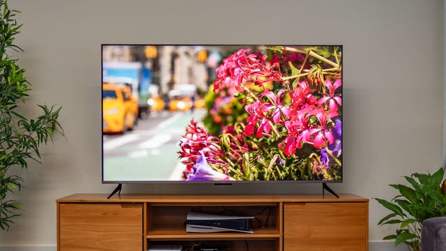 Roku TV on a wooden TV cabinet