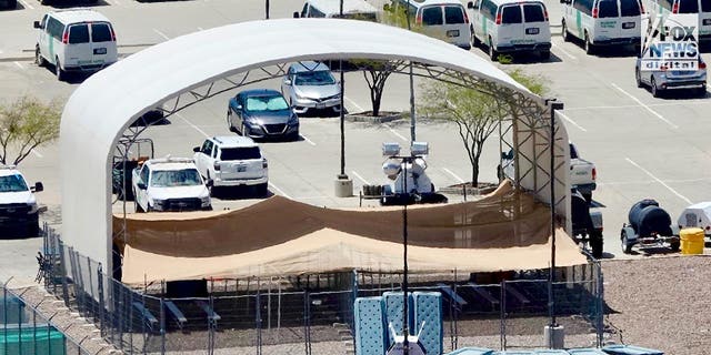 A large arched canopy with a lower canopy below it