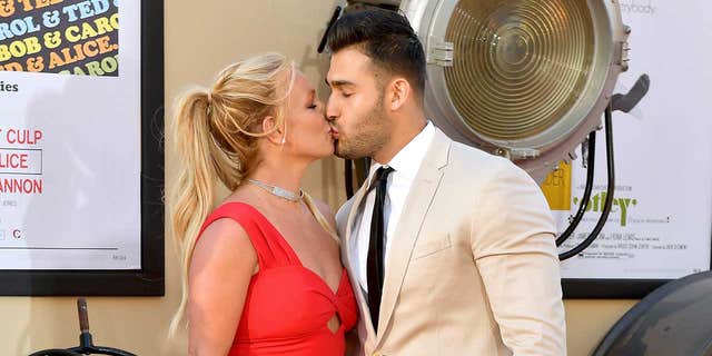 Britney Spears and Sam Asghari share a kiss