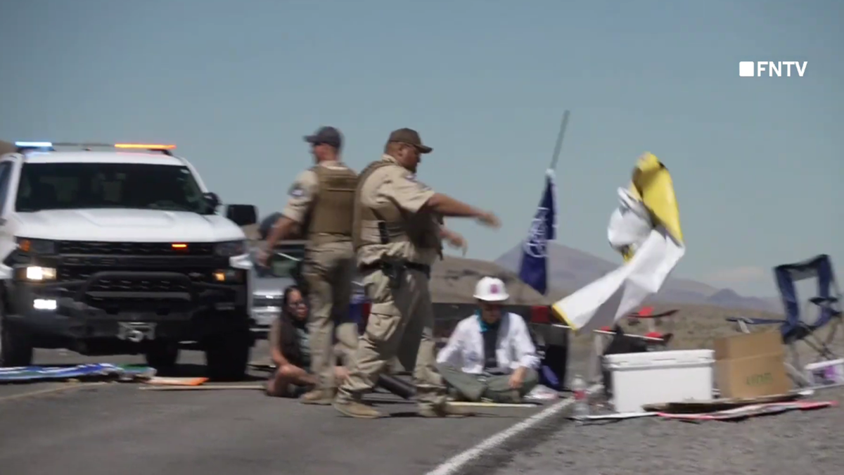 Nevada police toss climate protest signs