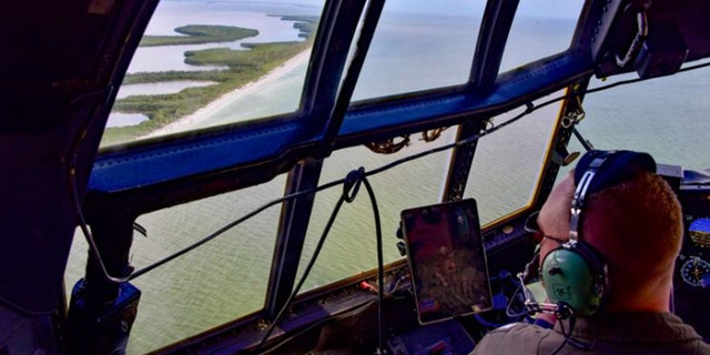 Coast Guard aircraft searching waters