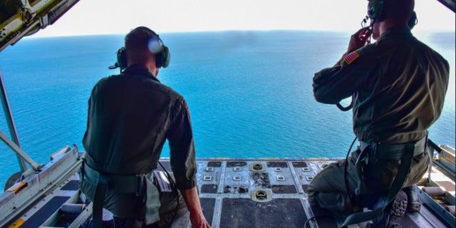 Coast Guard aircraft searching waters