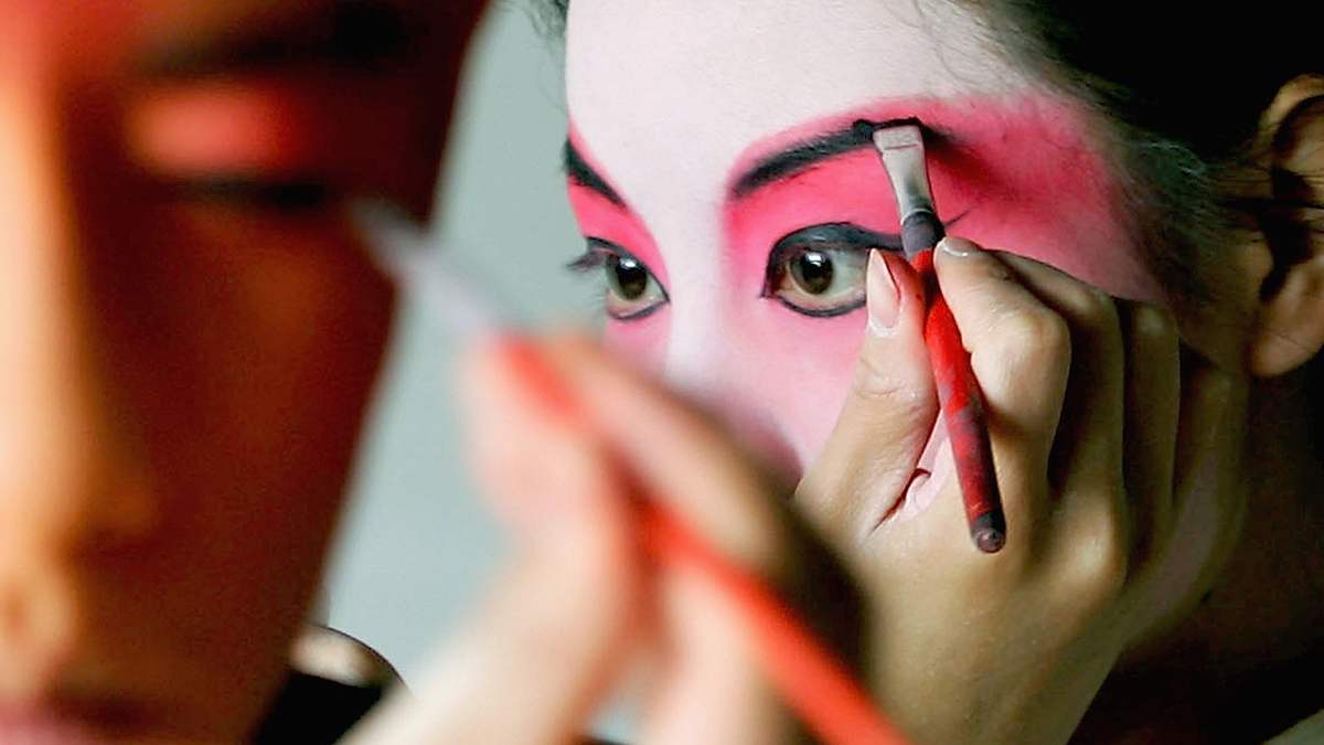 woman putting on face paint