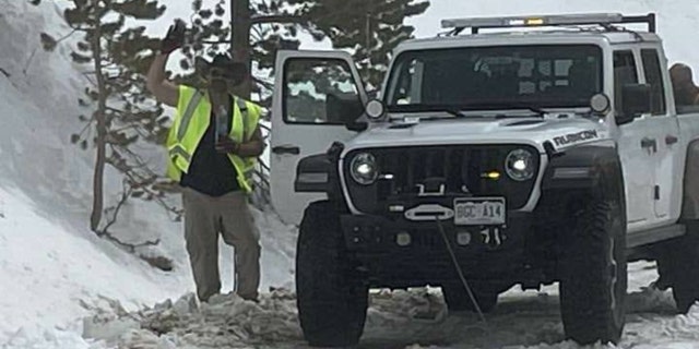 William Tidwell standing next to his search-and-rescue truck