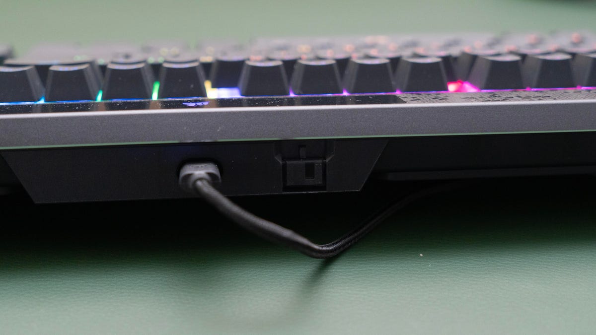 The top of the keyboard showing a USB-C cable connected and a switch to the right of it