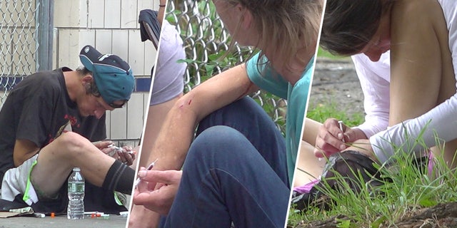 Drug users sitting down injecting themselves with needles