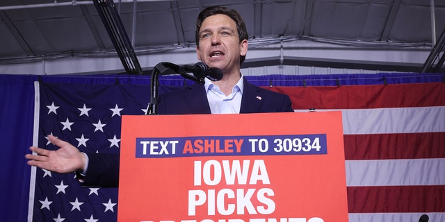 Republican presidential candidate Florida Governor Ron DeSantis speaks at podium in Iowa