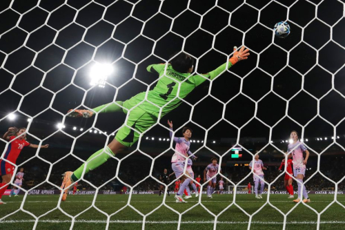 Japan's Ayaka Yamashita of Japan dives in vain to stop a Norway shot on goal.