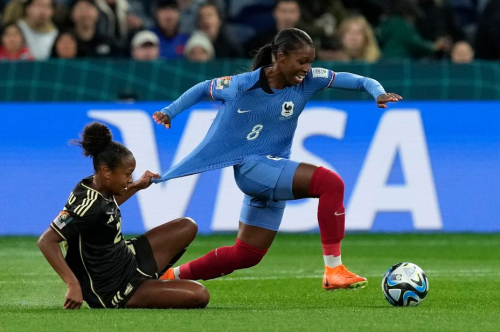 Jamaica's Atlanta Primus tugs the shirt of France's Grace Geyoro.