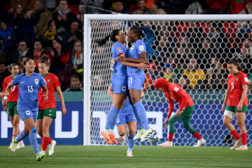 French midfielder Kenza Dali, left, celebrates with teammate Kadidiatou Diani against Morocco. 