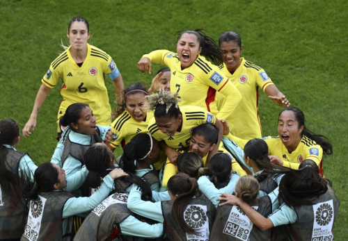 Colombia's Catalina Usme celebrates with teammates after scoring her team's first goal against South Korea on July 25. Colombia won 2-0.