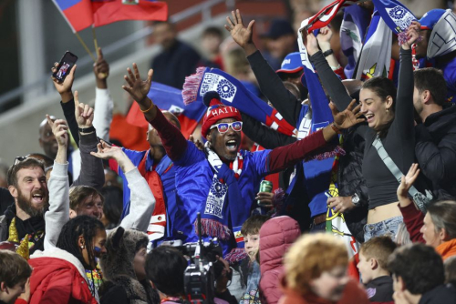 Haiti fans cheer their team at the stadium in Perth, Australia.